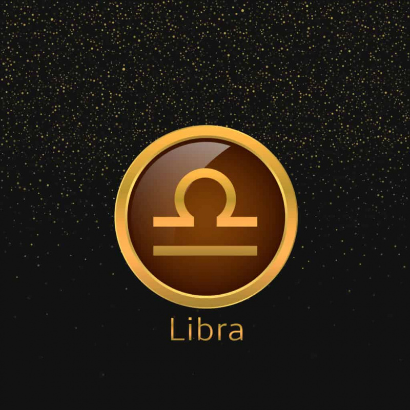   Signo de libra dourado sobre fundo preto